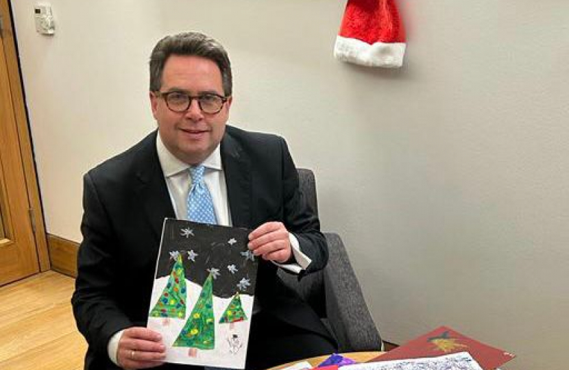 Craig Hoy with the winning xmas card