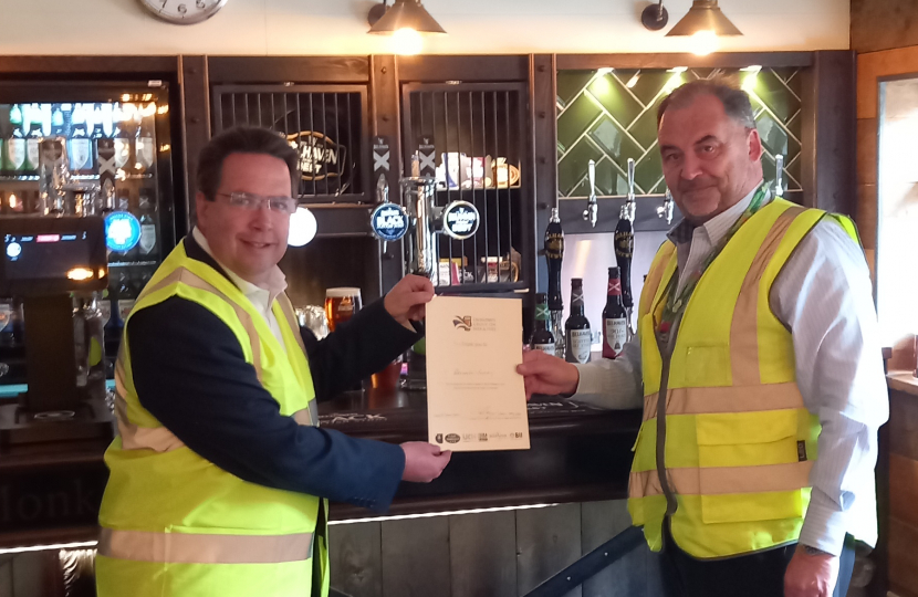 Craig Hoy MSP presenting 'Brew With Your MSP' award to Billy Mathers, Master Brewer at Belhaven Brewery.