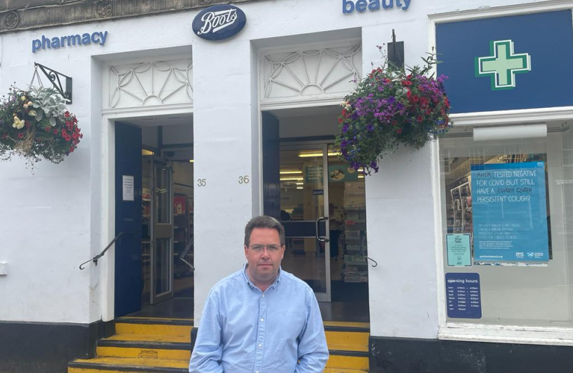 Craig Hoy MSP outside of Boots Pharmacy