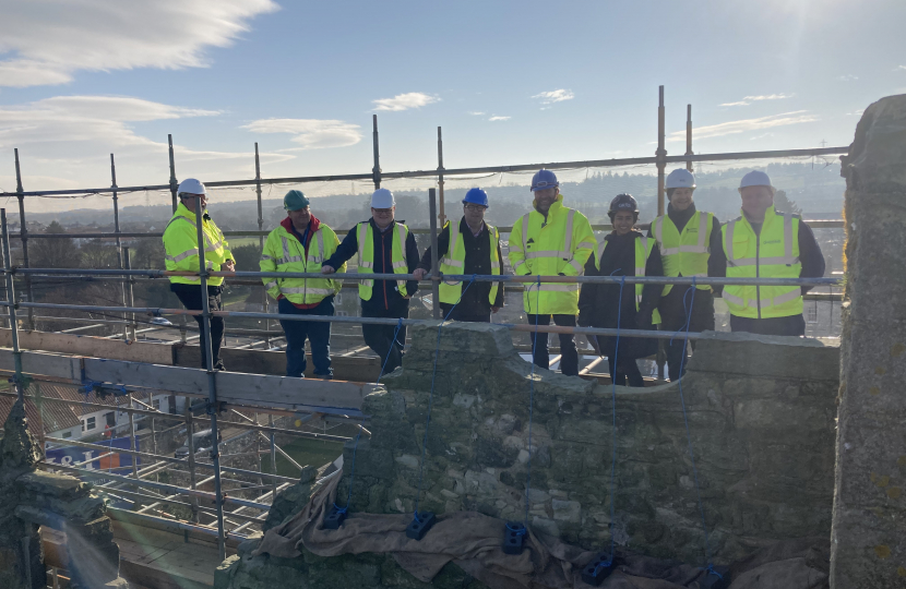 Craig and Cllr Lachlan Bruce with team on scaffolding