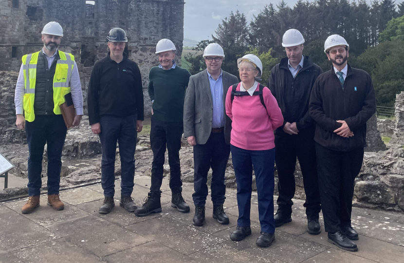 (left-to-right): Stuart Savage, National Delivery Lead for HLM programme at HES; Clive Cruickshank, District Architect at HES; Alfred McClintock (Dirleton Village Association); Craig Hoy MSP; Carole Anne Tweedie (Gullane & Dirleton History Society); Stuart Holmes, Regional Visitor and Community Manager at HES; and Andrew Spratt, Monument Manager at Dirleton Castle.