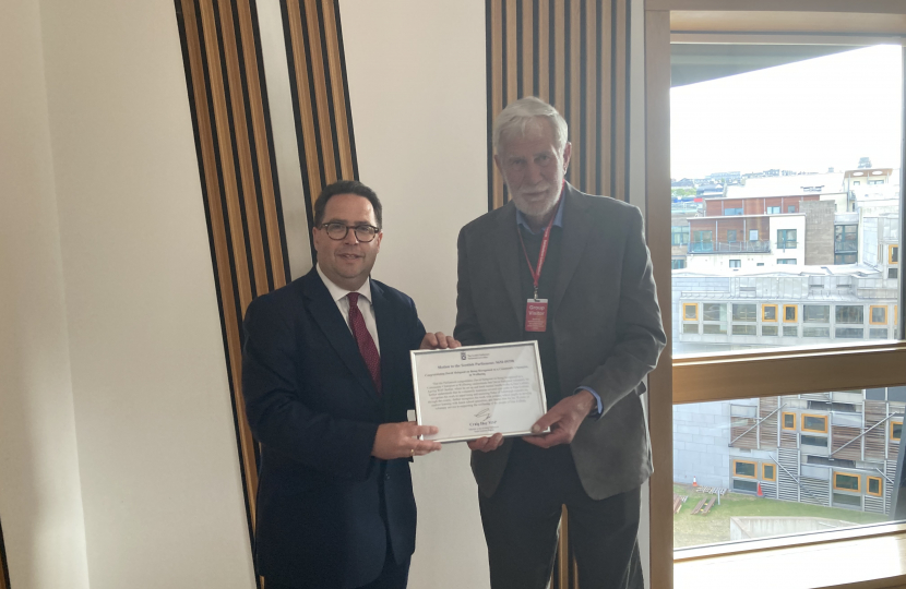 Craig Hoy MSP presenting a signed parliamentary motion to David Habgood