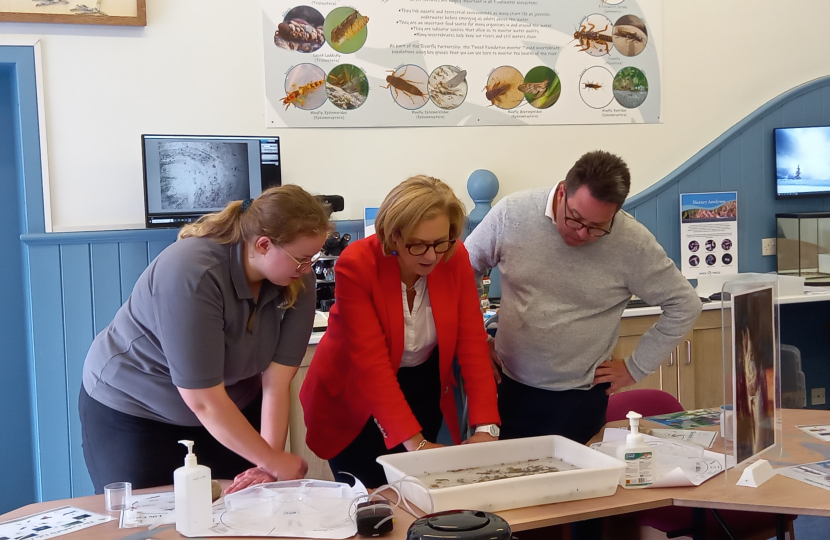 (left-to-right) Suzie Taylor (biologist) showing Rachael Hamilton MSP and Craig Hoy MSP live specimens from the River Tweed