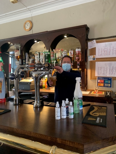 Craig Hoy MSP (left) pulling pints at the Castle Inn, Dirleton, with North Berwick Coastal Councillor Jeremy Findlay (right).