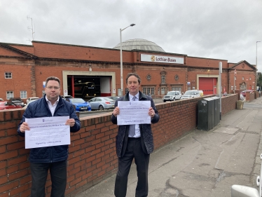 Craig Hoy MSP and Cllr Jeremy Findlay delivering petition to Lothian Buses