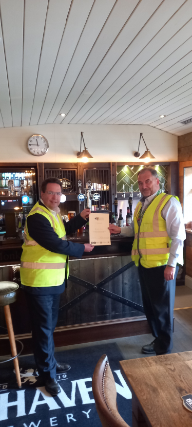 Craig Hoy MSP presenting 'Brew With Your MSP' award to Billy Mathers, Master Brewer at Belhaven Brewery.