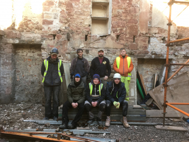 Some members of the Ridge Foundations’ team of apprentices with Andrew Stockdale, Head of Stonemasonry, on the left.