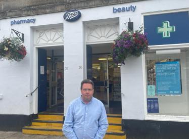 Craig Hoy MSP outside of Boots Pharmacy