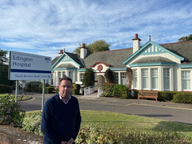 Craig Hoy MSP outside of Edington Cottage Hospital in Summer