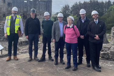 (left-to-right): Stuart Savage, National Delivery Lead for HLM programme at HES; Clive Cruickshank, District Architect at HES; Alfred McClintock (Dirleton Village Association); Craig Hoy MSP; Carole Anne Tweedie (Gullane & Dirleton History Society); Stuart Holmes, Regional Visitor and Community Manager at HES; and Andrew Spratt, Monument Manager at Dirleton Castle.