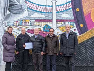 (left-to-right) Angela Crow (Manager); Jonathan Andrews (Treasurer); Ian Dalgleish (Chair); Craig Hoy MSP; and Mike Gray (Former Chair)