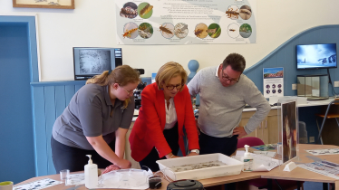 (left-to-right) Suzie Taylor (biologist) showing Rachael Hamilton MSP and Craig Hoy MSP live specimens from the River Tweed